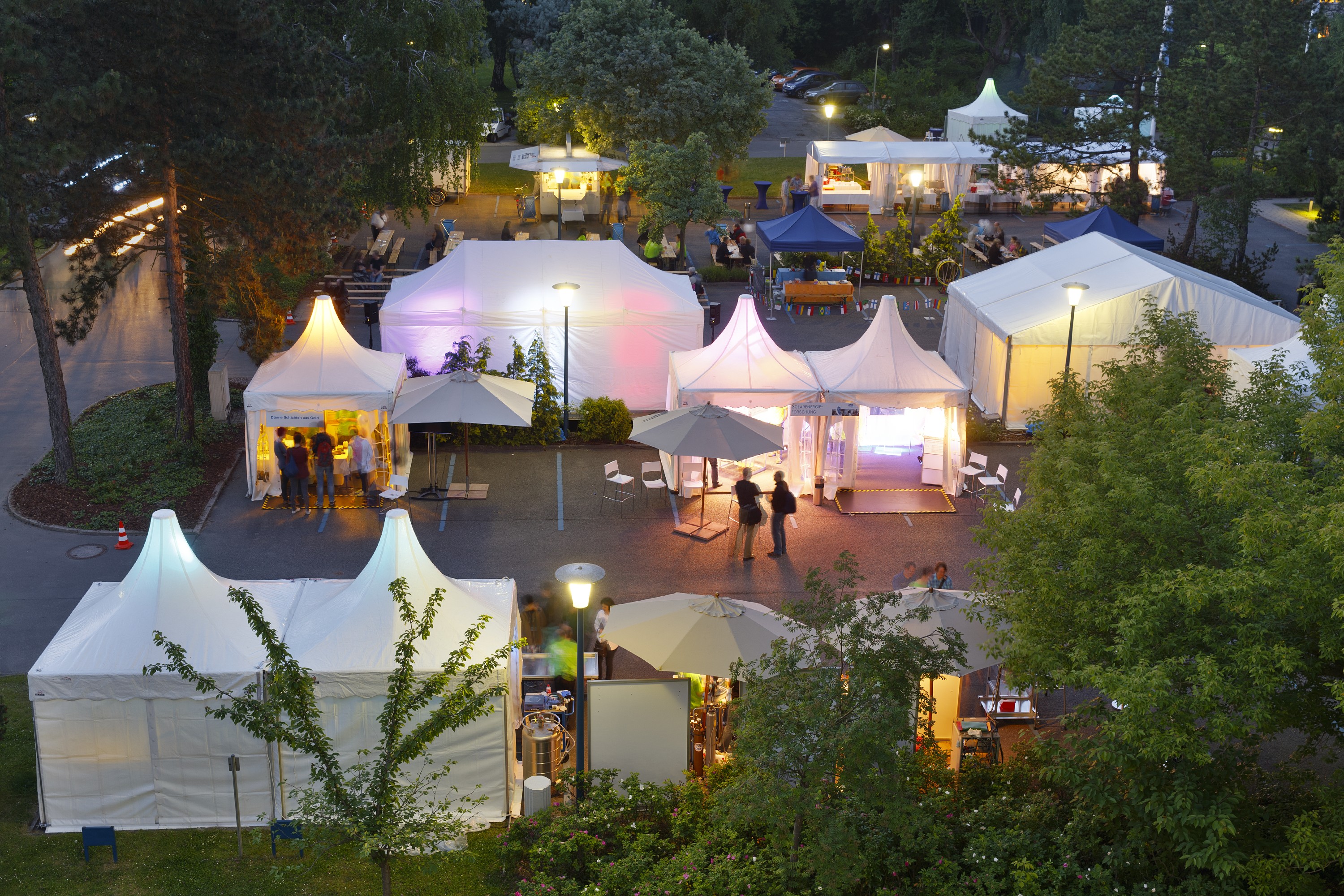 Shot of tents that are glowing in colourful lights at the Science Night