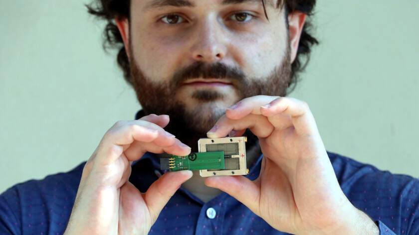 Michele Segantini demonstrates the compact size and the portability of one of the EPRoC-Sensor with a permanent magnet.